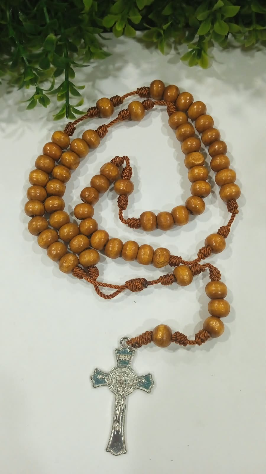 Jefgo rosary featuring 4mm brown wooden beads and a detailed silver-tone crucifix pendant on a durable cord.
